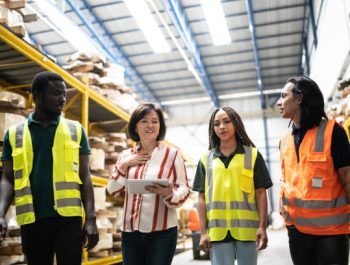 Manager talking to the team in a factory